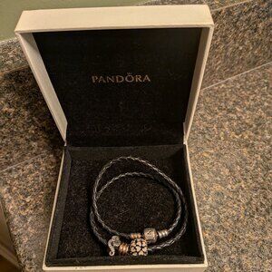 Multiple Pandora bracelets and charms
